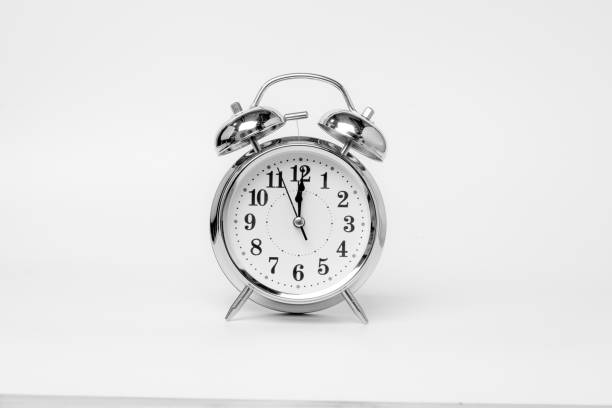 istock Retro alarm clock isolated on white background. 1395289963