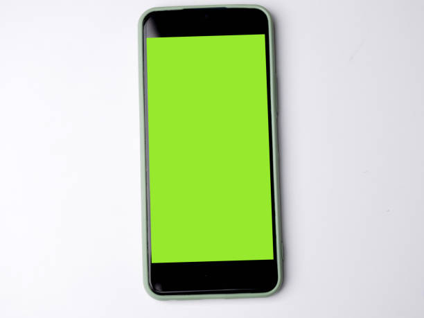 istock Smartphone with green screen and modern design isolated on white background. 1395289994
