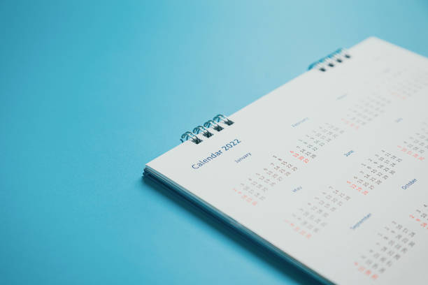 istock Close top view on white calendar 2022 month schedule Work planning and life concept. 1395291235