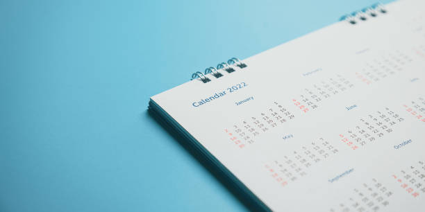 Close top view on white calendar 2022 month schedule Work planning and life concept.
