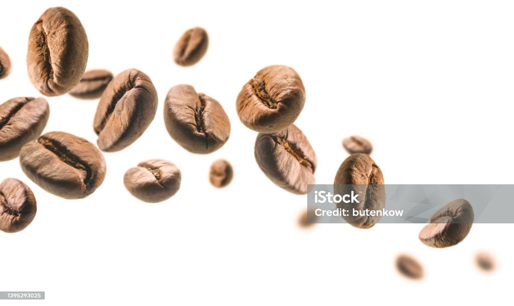 Coffee beans levitate on a white background Coffee beans levitate on a white background. Coffee - Drink Stock Photo