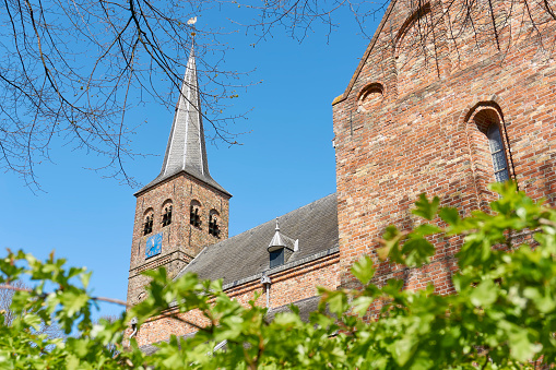 View on the romano-gothic protestant church of Burgum, The Netherlands from the 13th century. Also known as Cross Church, Saint Martin's church or Kruiskerk.
