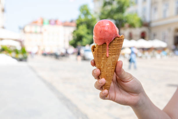istock woman hand holding melting ice cream 1395293955