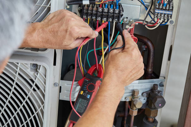 istock Electrician fixing or repairing electrical equipment. 1395294418
