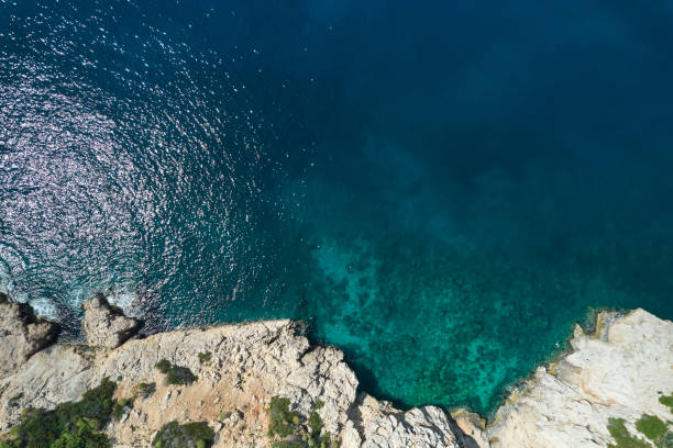 istock Aerial view of waves splashing on beach 1395295029
