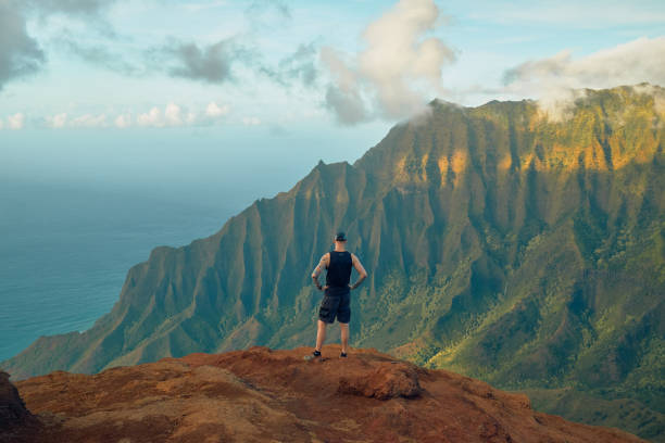 The rugged Na Pali coast and mountain range is part of the lush island of Kauai, Hawaii. The Kalalau Valley hosts the dangerous Kalalau Trail.