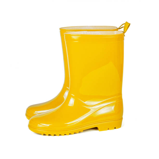 istock Yellow rubber boots isolated on white background 1395297342