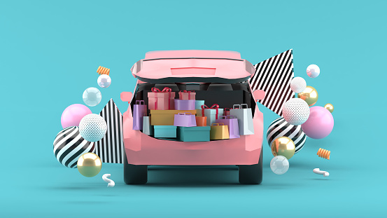 The trunk of the car is filled with shopping bags on a blue background.-3d rendering.
