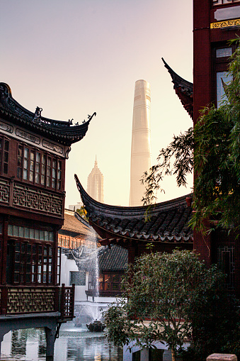Modern skyscrapers in Shanghai’s Pudong District contrasted with traditional buildings in Yu Garden (豫园)