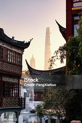 istock Modern skyscrapers in Shanghai contrasted with traditional buildings in Yu Garden 1395298672