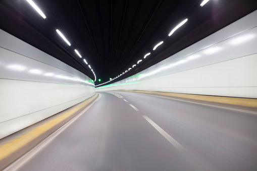Car angle view of high speed motion within roadway in tunnel, Yan’andonglu Tunnel, China