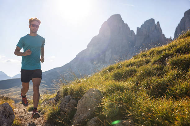 istock Young man trail running on mountain: the Dolomites 1395300648