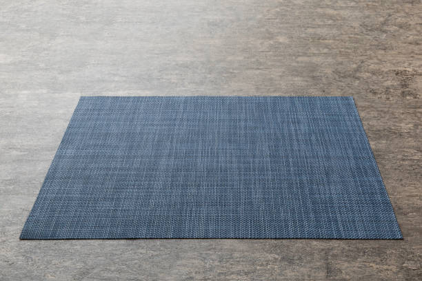 istock Perspective view of blue tablecloth for food on cement background. Empty space for your design 1395303270