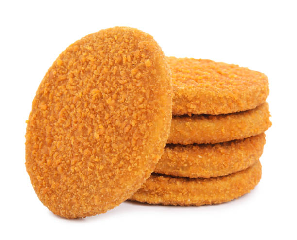 istock Uncooked breaded cutlets on white background. Freshly frozen semi-finished product 1395304886