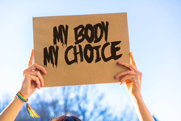 A woman holding a sign in favor of the legalization of abortion. Protest not to make abortion illegal in the united states, pro-choice, pro-life stock photo