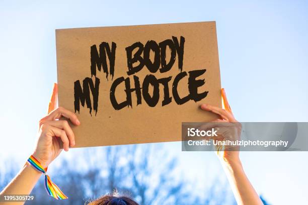 A Woman Holding A Sign In Favor Of The Legalization Of Abortion Protest Not To Make Abortion Illegal In The United States Prochoice Prolife Stock Photo - Download Image Now