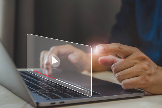 istock Businessman hands using laptop for streaming online. 1395306166