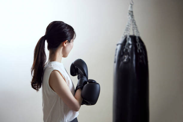 istock A young Japanese woman practicing boxing 1395306253