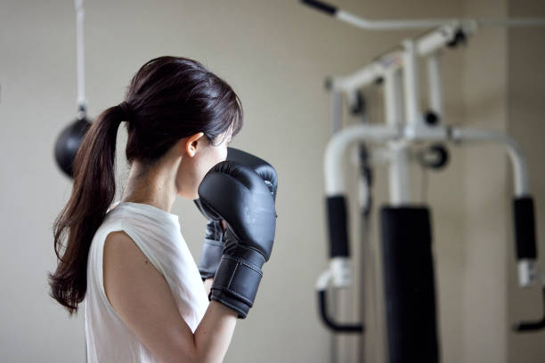 istock A young Japanese woman practicing boxing 1395306265