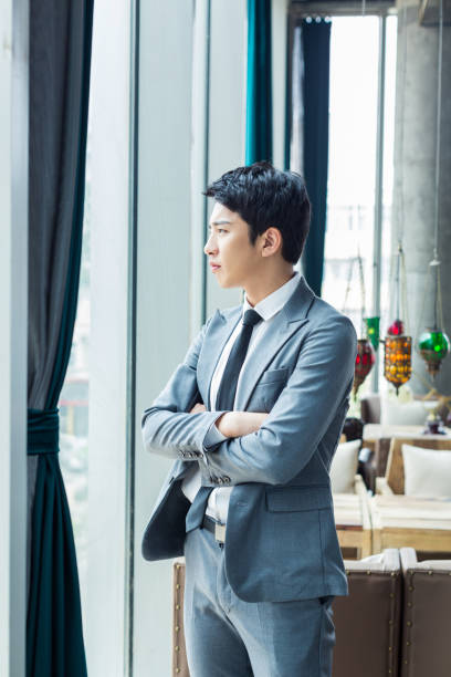 chinese man wearing a suit stock photo
