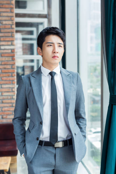 istock chinese man wearing a suit 1395306460
