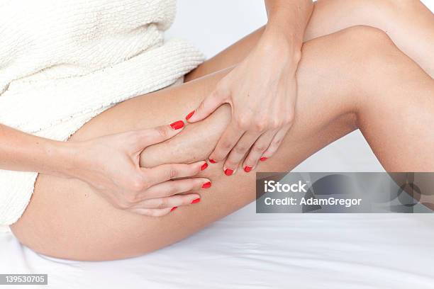 Woman Checking Her Legs For Cellulite Stock Photo - Download Image Now - Cellulite, Massaging, Pinching