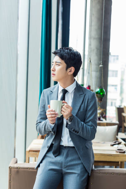 istock chinese man wearing a suit 1395307082