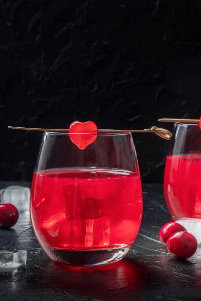 istock Cocktail cherry and a mocktail on a dark background, a vibrant red drink 1395307148