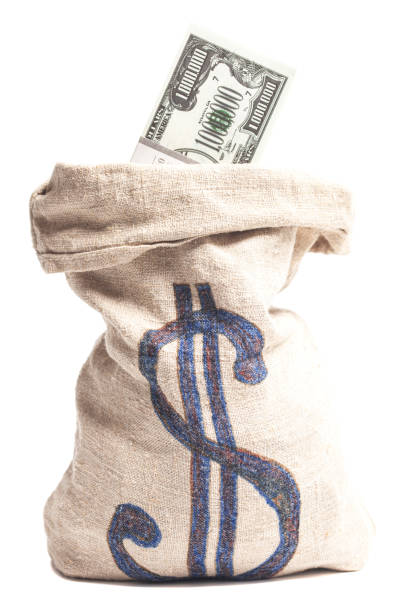 istock Money bag with one million dollars bills isolated on white 1395309023