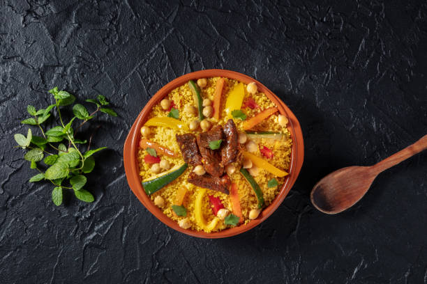 istock Couscous with meat and vegetables, festive Moroccan dinner, overhead 1395310028