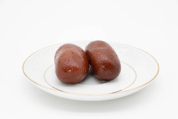 istock black sweet Also Know as golabjamon over on white background 1395312061