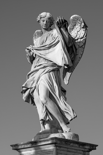 Rome - The statue of Angel with the Sudarium on the Ponte Sant'Angelo by Cosimo Fancelli (1620  - 1688).