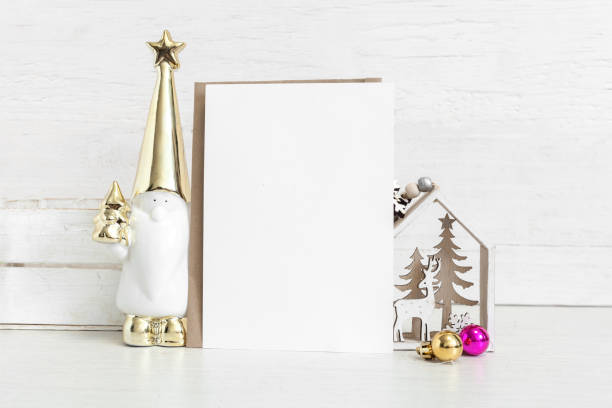 istock White vertical card with gnome and christmas attributes. 1395312899