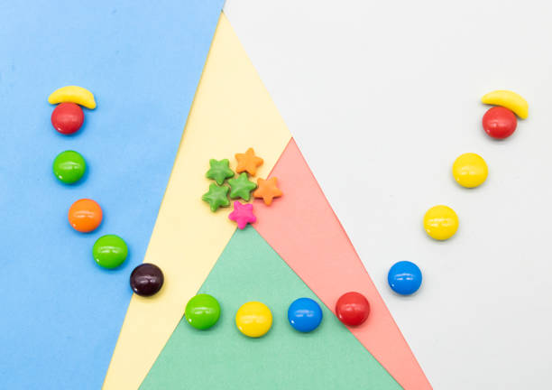 Colorful candies isolated on colored background