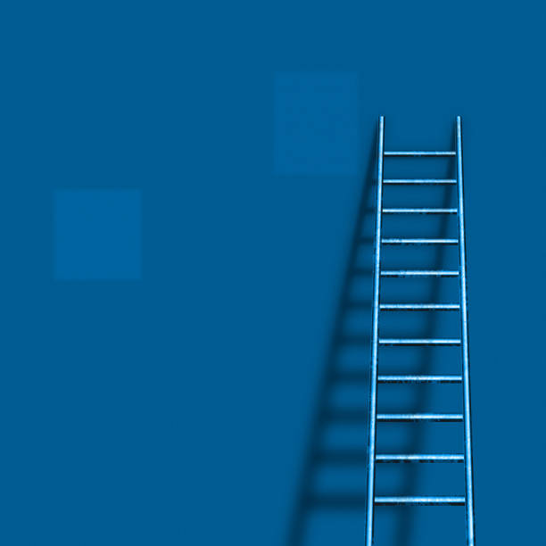istock Ladder leans to blue wall 1395315984