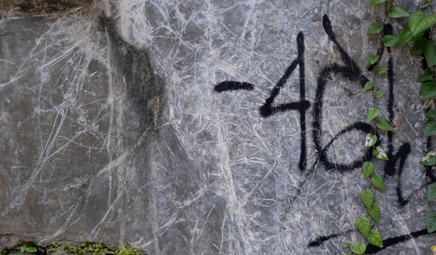 istock Old gray cement wall with black numbers grunge texture 1395317052