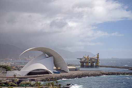 Oil drilling platform with a view to Auditorio de Tenerife is designed by the architect Santiago Calatrava (born 1951) and was finished in 2003 and are situated close to the harbor of Santa Cruz which is the main city on the Spanish Canary Island Tenerife