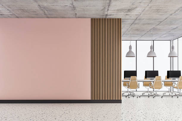 istock Empty office interior with copy space, work desks on terrazzo floor and plaster/hardwood paneled wall 1395318478