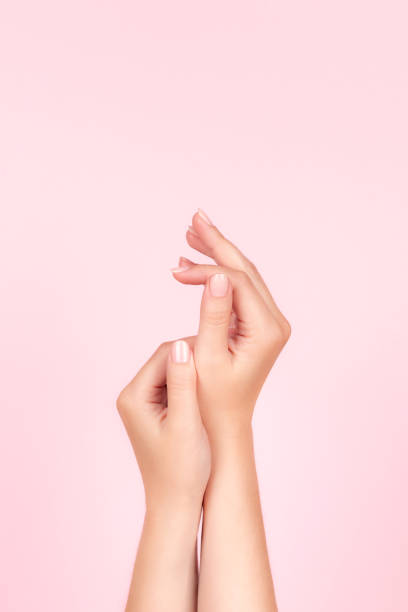 istock Female hands with nude nails 1395319539