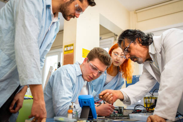 istock Group of young people in technical vocational training with teacher 1395320149