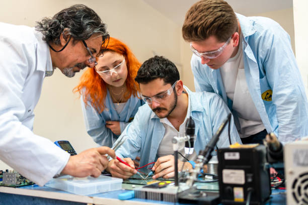 istock Group of young people in technical vocational training with teacher 1395320948