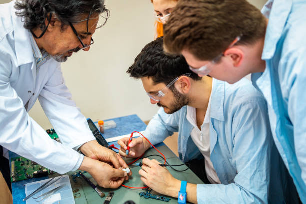istock Group of young people in technical vocational training with teacher 1395321194