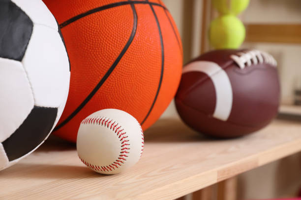 istock Different sport balls on wooden shelf, closeup 1395322155