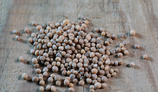 chinese medicinesemen brassicae  on wooden table