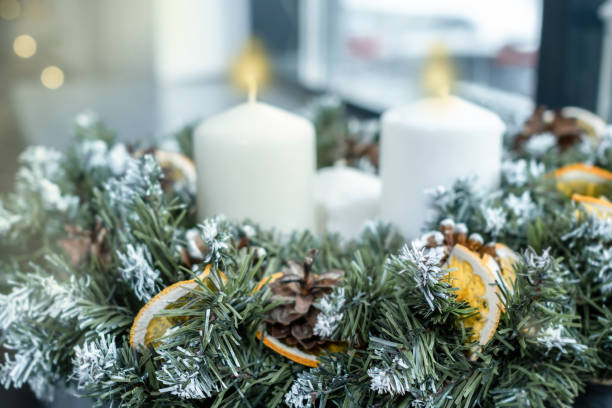 Christmas wreath made of spruce with candles. Soft focus