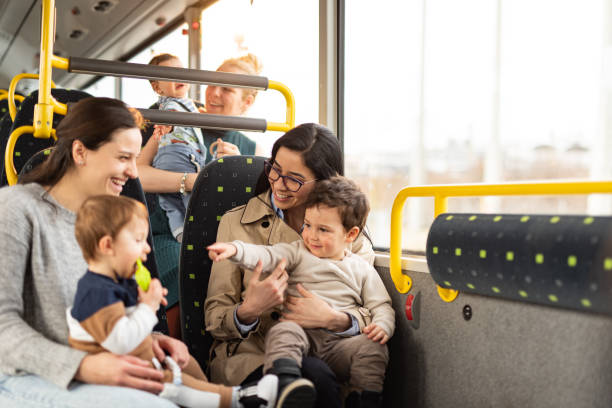 Group of mothers and children in bus stock photo