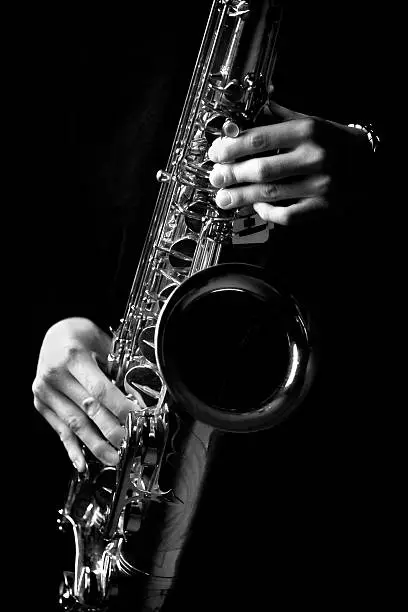 details of a person playing a saxophone