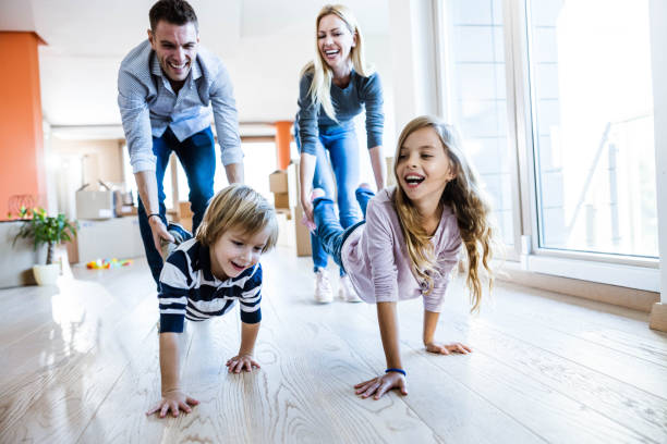 istock Wheelbarrow race at new apartment! 1395326522
