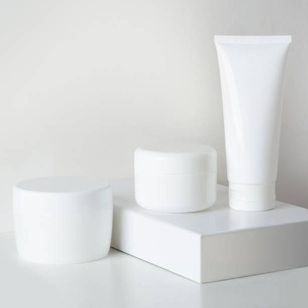 istock different white boxes of body cream on a pedestal on a light background 1395326540
