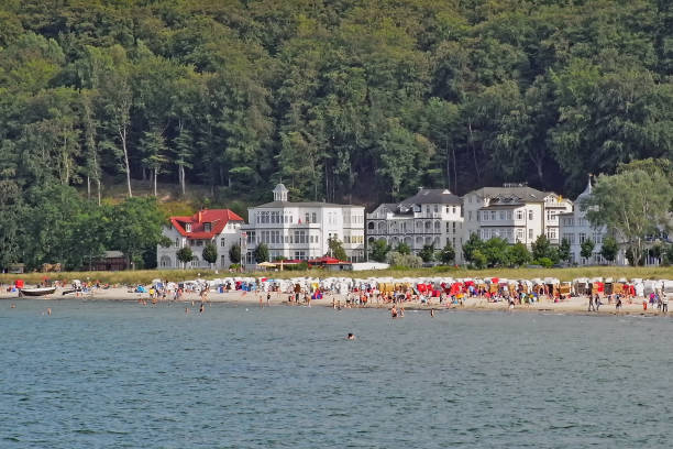 tourists enjoy their holiday in summer on the beach of binz on the baltic sea island of rügen - binz imagens e fotografias de stock